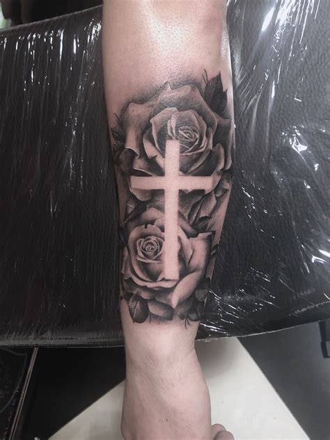 cross rose tattoo meaning|cross with roses and butterflies.